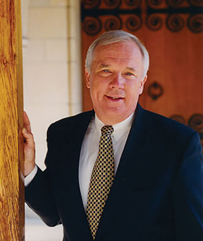 William Willimon standing by a door