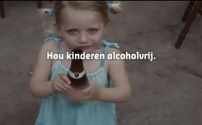 Child drinking alcohol in home video