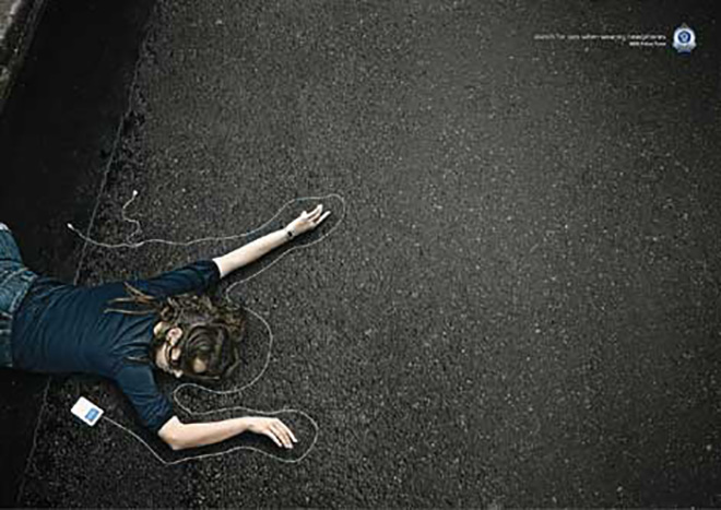 Headphones cable used to map the arms in NSW road safety advertisement