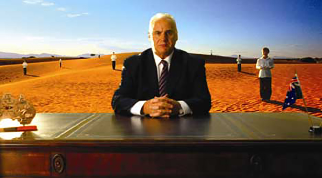 Sam Kekovich in the desert with choir boys and girls