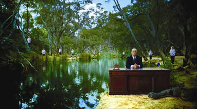 Sam Kekovich by a river with choir boys and girls