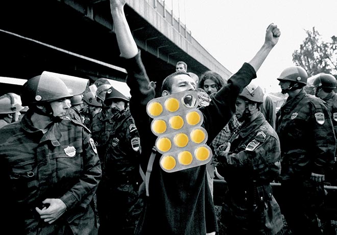 Protester in Strepsils print advertisement