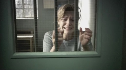 Woman behind bars in Barnardo's Break The Cycle TV advert