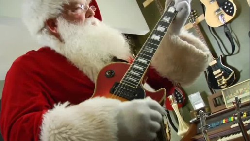 Santa plays guitar in Thwak video