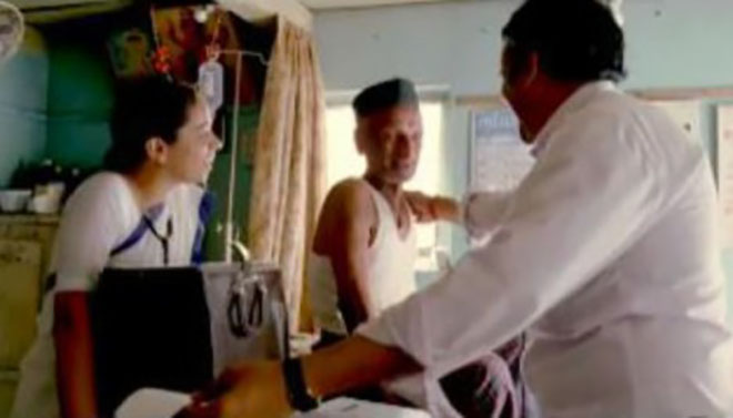 Doctor uses small electrocardiograph in an Indian clinic